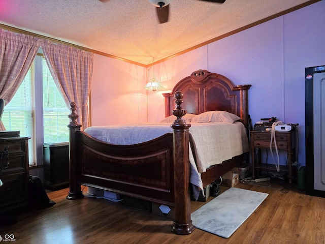 8310 Dog Trot Ln, Morgantown, IN 46160 - bedroom with a textured ceiling, wood finished floors, ornamental molding, and ceiling fan