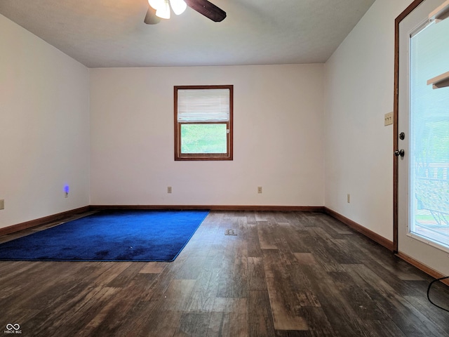 8310 Dog Trot Ln, Morgantown, IN 46160 - unfurnished room featuring wood finished floors, healthy amount of natural light, a ceiling fan, and baseboards