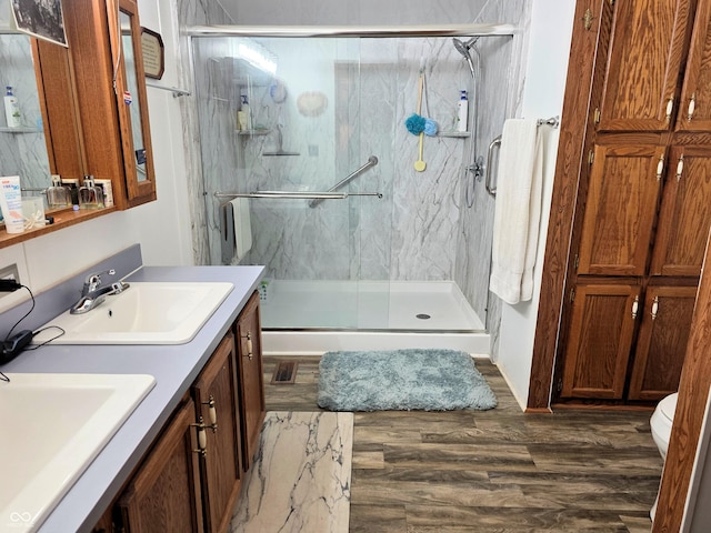8310 Dog Trot Ln, Morgantown, IN 46160 - full bath featuring double vanity, a marble finish shower, wood finished floors, and toilet