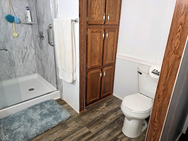 8310 Dog Trot Ln, Morgantown, IN 46160 - bathroom with a marble finish shower, wood finished floors, toilet, and a wainscoted wall