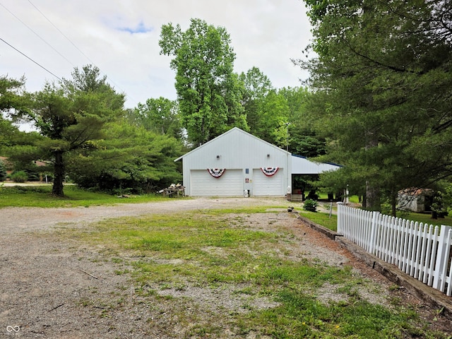8310 Dog Trot Ln, Morgantown, IN 46160 - view of property exterior with a garage and an outbuilding
