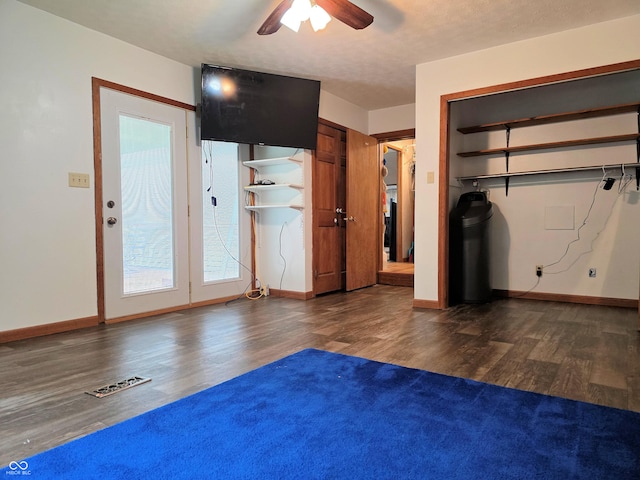 8310 Dog Trot Ln, Morgantown, IN 46160 - unfurnished bedroom featuring wood finished floors, baseboards, and ceiling fan