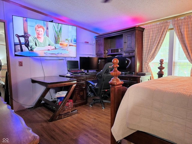 8310 Dog Trot Ln, Morgantown, IN 46160 - bedroom with a textured ceiling, wood finished floors, and a desk
