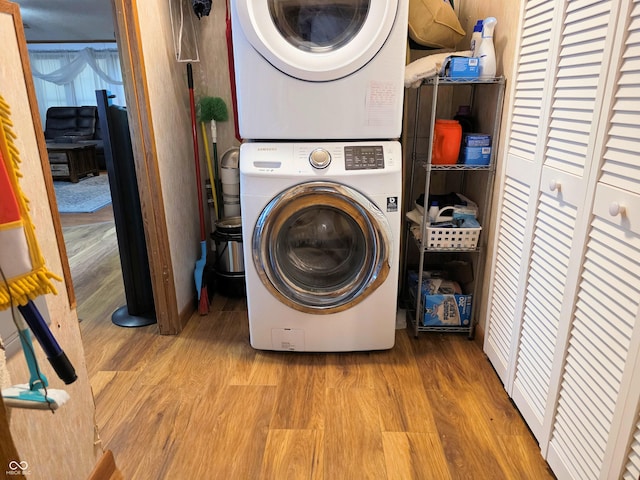 8310 Dog Trot Ln, Morgantown, IN 46160 - laundry area with stacked washer / dryer and wood finished floors