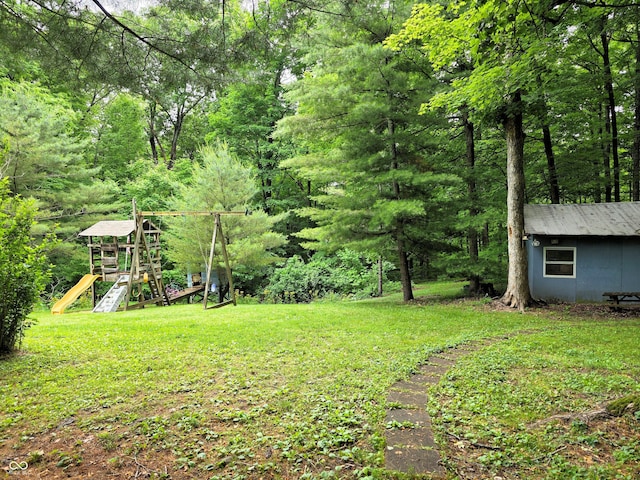 8310 Dog Trot Ln, Morgantown, IN 46160 - view of green lawn with a playground and a forest view