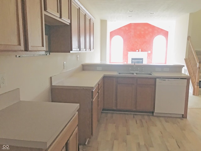 855 Gazebo Way Unit C, Greenwood, IN 46142 - kitchen featuring dishwasher, a peninsula, light wood finished floors, and light countertops