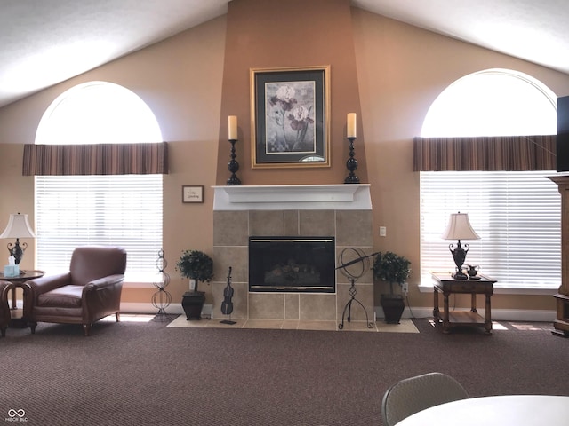 855 Gazebo Way Unit C, Greenwood, IN 46142 - carpeted living area featuring lofted ceiling and a tiled fireplace
