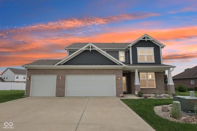 13163 N Departure Blvd W, Camby, IN 46113 - craftsman house featuring concrete driveway, a garage, covered porch, brick siding, and roof with shingles