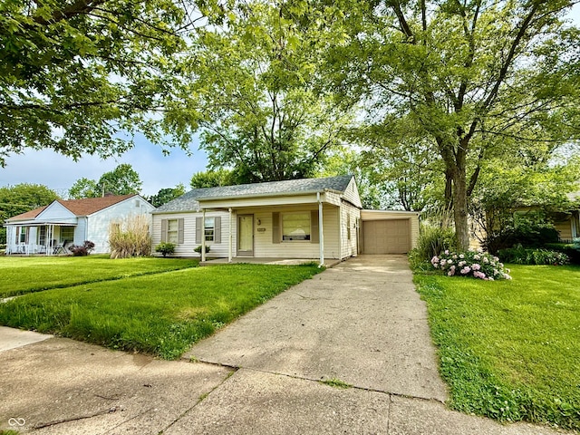 910 Lonsvale Dr, Anderson, IN 46013 - view of front of home with covered porch, a front lawn, and driveway