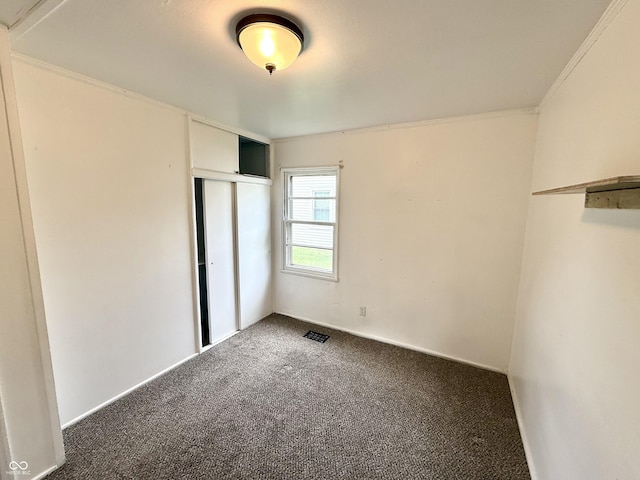 910 Lonsvale Dr, Anderson, IN 46013 - unfurnished bedroom with carpet flooring, a closet, and ornamental molding