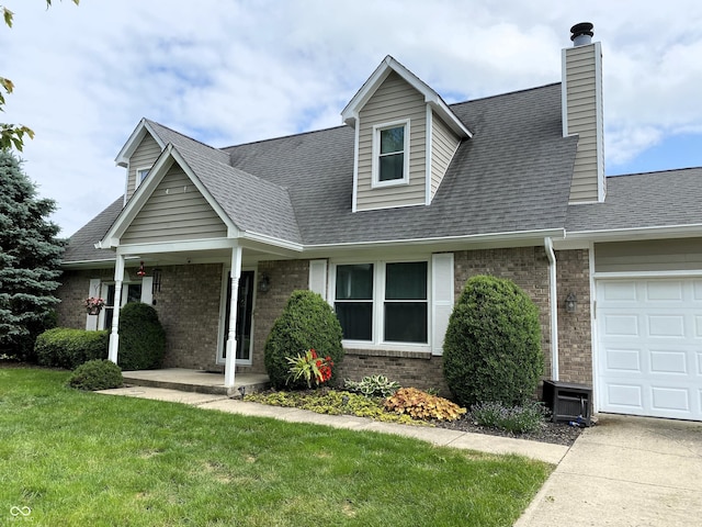 1135 W Wildflower Ct, Mooresville, IN 46158 - view of front facade with brick siding, an attached garage, a front lawn, a chimney, and roof with shingles