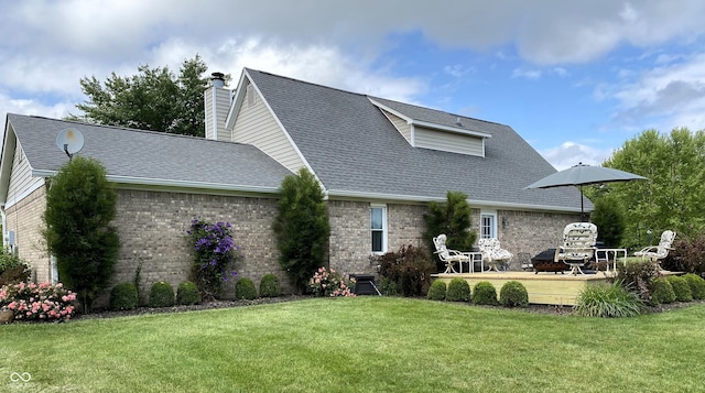 1135 W Wildflower Ct, Mooresville, IN 46158 - back of property featuring a wooden deck, brick siding, a yard, and a chimney