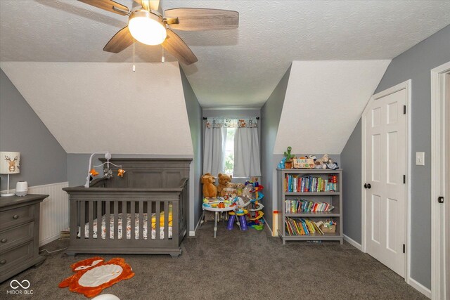 1135 W Wildflower Ct, Mooresville, IN 46158 - bedroom featuring a textured ceiling, a nursery area, carpet floors, lofted ceiling, and ceiling fan