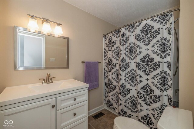 1135 W Wildflower Ct, Mooresville, IN 46158 - full bathroom featuring toilet, vanity, a textured ceiling, a shower with shower curtain, and tile patterned flooring