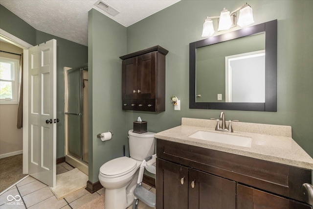 1135 W Wildflower Ct, Mooresville, IN 46158 - bathroom with vanity, a stall shower, toilet, tile patterned flooring, and baseboards