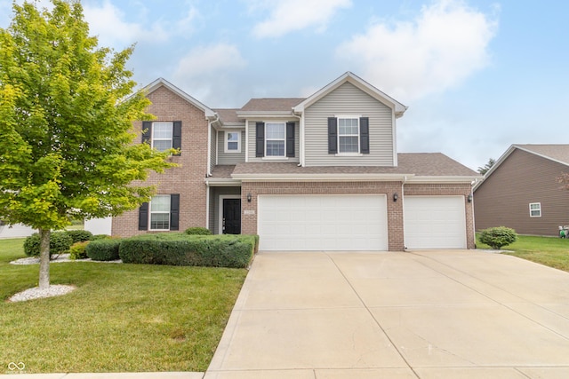 2260 Santa Fe Dr, Greenfield, IN 46140 - view of front of home with brick siding, driveway, a front lawn, and an attached garage