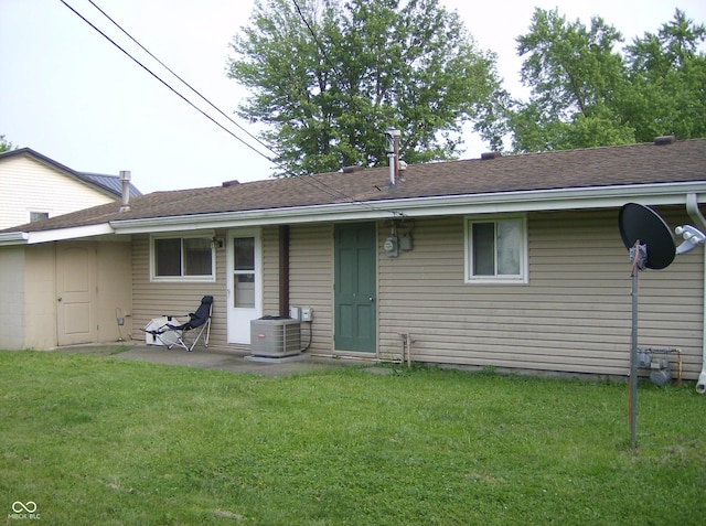 80 Brentwood Dr, Mooresville, IN 46158 - rear view of property featuring cooling unit, a lawn, and roof with shingles