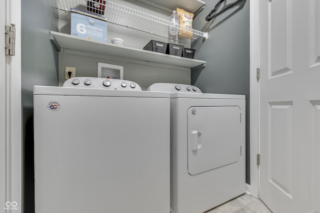 933 Curlew Ln, Greenwood, IN 46143 - washroom featuring separate washer and dryer and marble finish floors