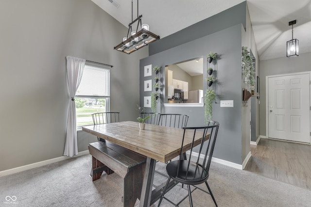 933 Curlew Ln, Greenwood, IN 46143 - carpeted dining space featuring baseboards and a towering ceiling
