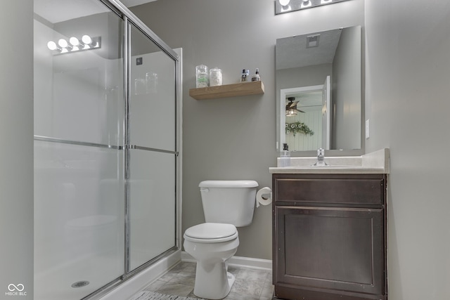 933 Curlew Ln, Greenwood, IN 46143 - bathroom with toilet, a shower stall, vanity, and baseboards
