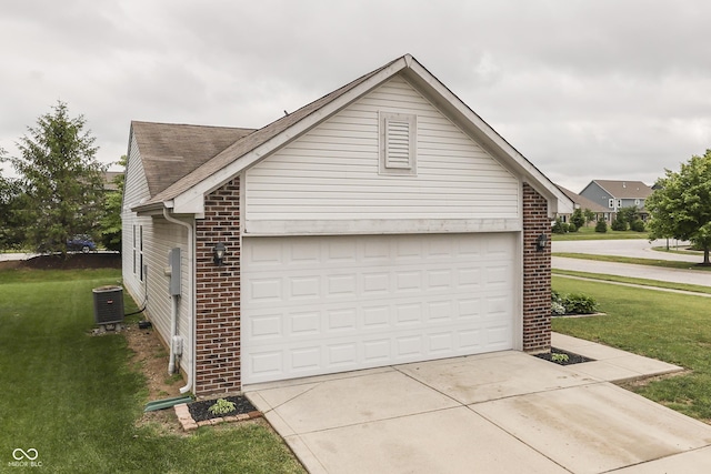 933 Curlew Ln, Greenwood, IN 46143 - view of home's exterior with brick siding, cooling unit, and a yard