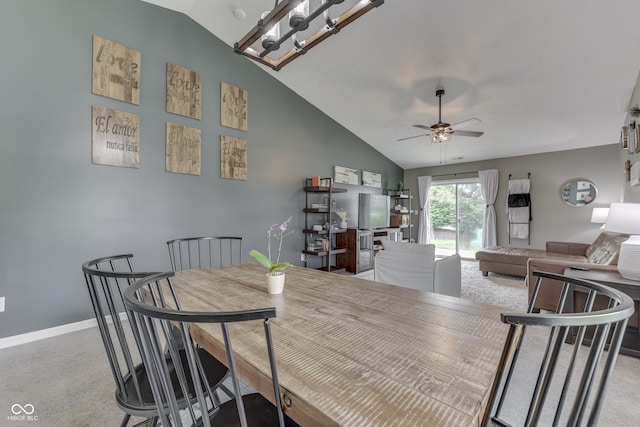 933 Curlew Ln, Greenwood, IN 46143 - dining room with vaulted ceiling, carpet, a ceiling fan, and baseboards