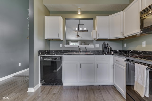 933 Curlew Ln, Greenwood, IN 46143 - kitchen with black appliances, a sink, dark countertops, white cabinetry, and light wood-type flooring