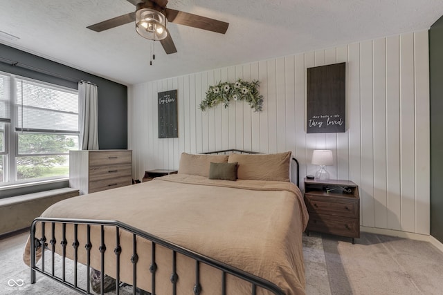 933 Curlew Ln, Greenwood, IN 46143 - bedroom featuring light colored carpet, a ceiling fan, and a textured ceiling