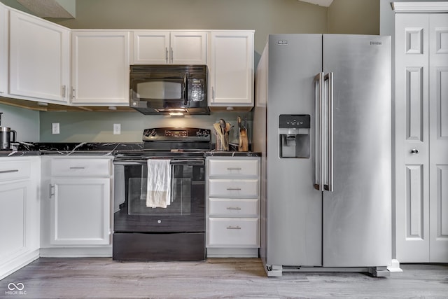 933 Curlew Ln, Greenwood, IN 46143 - kitchen with black appliances, dark countertops, white cabinetry, and light wood-style flooring