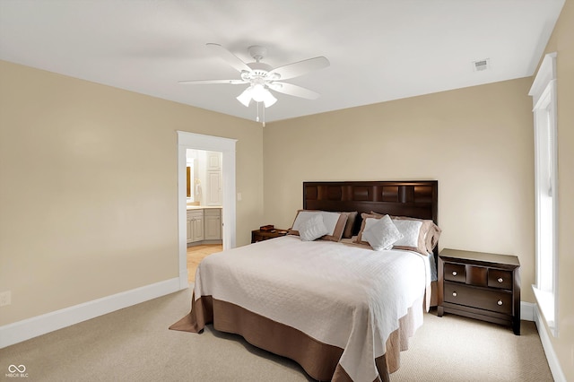 203 N Cross St, Hillsboro, IN 47949 - bedroom with light carpet, ensuite bathroom, and ceiling fan