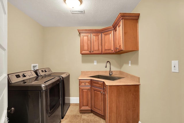 203 N Cross St, Hillsboro, IN 47949 - laundry area featuring washing machine and clothes dryer, cabinet space, and light tile patterned floors