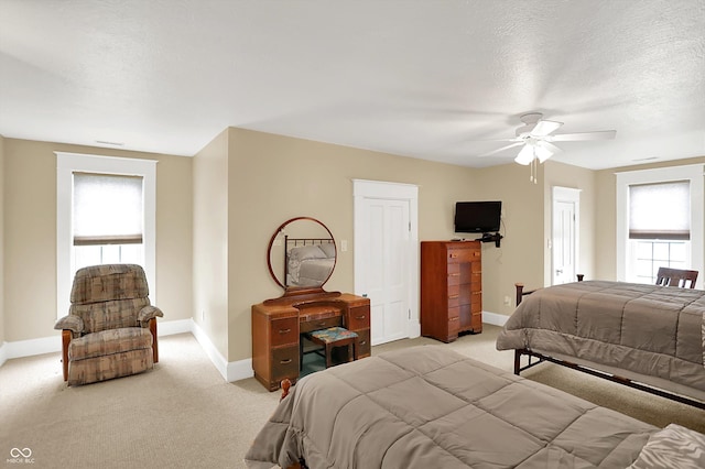 203 N Cross St, Hillsboro, IN 47949 - bedroom with light carpet, a textured ceiling, and ceiling fan