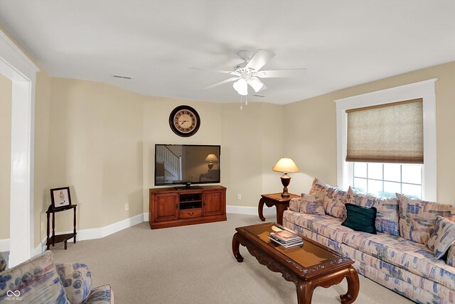203 N Cross St, Hillsboro, IN 47949 - living area featuring ceiling fan and light colored carpet