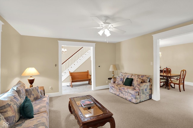 203 N Cross St, Hillsboro, IN 47949 - living room featuring stairs, carpet, a chandelier, and a ceiling fan