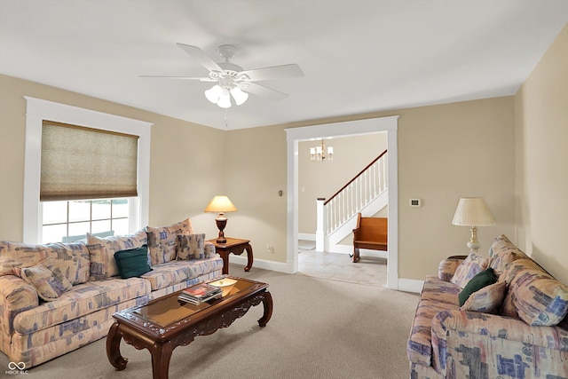 203 N Cross St, Hillsboro, IN 47949 - living area with stairway, light colored carpet, a chandelier, and ceiling fan