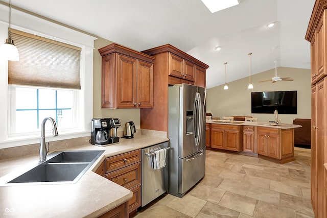 203 N Cross St, Hillsboro, IN 47949 - kitchen with appliances with stainless steel finishes, lofted ceiling, brown cabinetry, hanging light fixtures, and ceiling fan