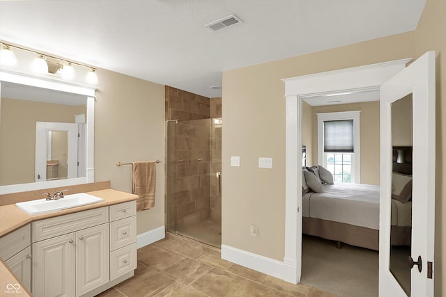203 N Cross St, Hillsboro, IN 47949 - full bathroom with connected bathroom, vanity, a stall shower, and tile patterned flooring