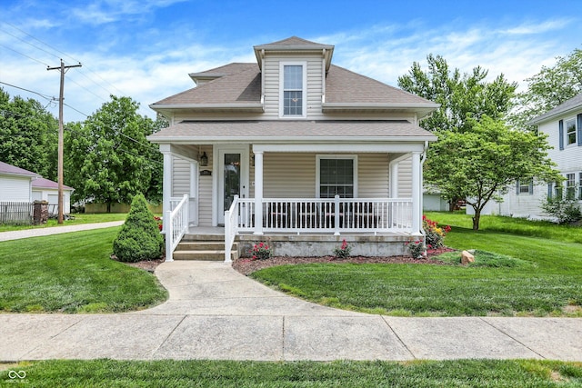 203 N Cross St, Hillsboro, IN 47949 - bungalow-style house featuring a shingled roof, a porch, and a front lawn