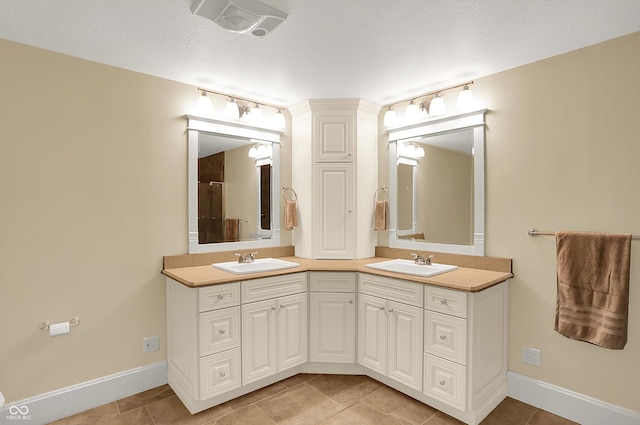 203 N Cross St, Hillsboro, IN 47949 - bathroom featuring double vanity, tile patterned flooring, and a shower