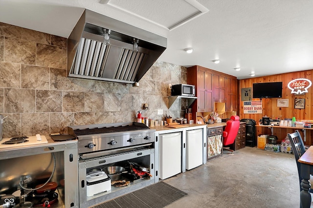 203 N Cross St, Hillsboro, IN 47949 - kitchen with ventilation hood, light countertops, stainless steel microwave, fridge, and concrete floors