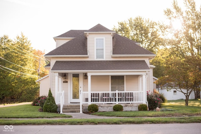 203 N Cross St, Hillsboro, IN 47949 - view of front of home with a shingled roof, covered porch, and a front lawn