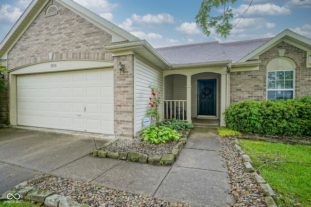 7724 Blackthorn Dr, Indianapolis, IN 46236 - view of front of house with brick siding, concrete driveway, a porch, an attached garage, and roof with shingles