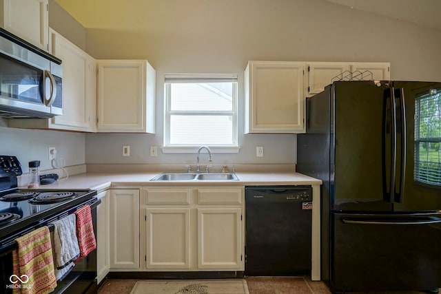 7724 Blackthorn Dr, Indianapolis, IN 46236 - kitchen with black appliances, a sink, light countertops, white cabinets, and vaulted ceiling