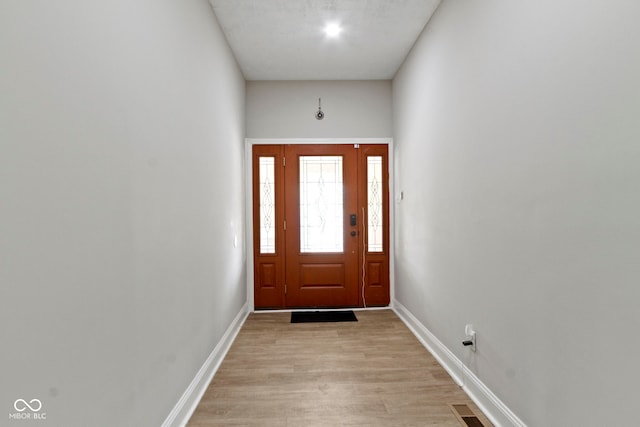 1150 W 30th St, Indianapolis, IN 46208 - entryway with light wood-type flooring and baseboards