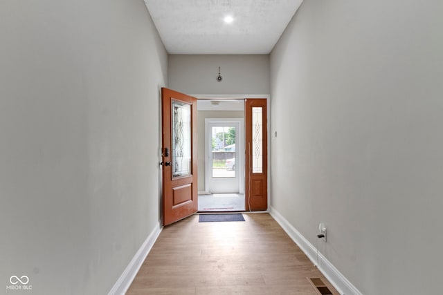 1150 W 30th St, Indianapolis, IN 46208 - entrance foyer featuring light wood finished floors and baseboards