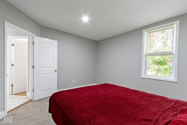 1150 W 30th St, Indianapolis, IN 46208 - bedroom featuring light carpet and baseboards