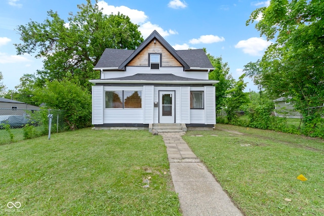 1150 W 30th St, Indianapolis, IN 46208 - bungalow-style home featuring roof with shingles