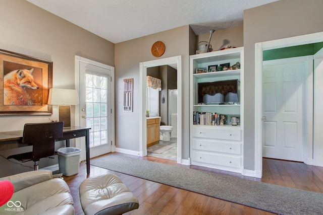 3533 Alexandria Pike, Anderson, IN 46012 - living room with wood-type flooring, baseboards, and a desk
