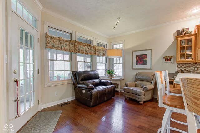 3533 Alexandria Pike, Anderson, IN 46012 - living room featuring ornamental molding, dark wood-style floors, and baseboards