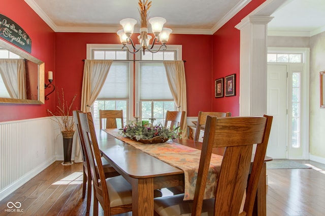 3533 Alexandria Pike, Anderson, IN 46012 - dining room featuring wood-type flooring, a chandelier, ornamental molding, and ornate columns